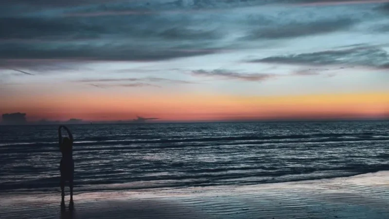 Person Watching a Sunset at the Florida Beach - A symbol of new beginnings, Start LLC in Florida, new journey, business setup, sunrise